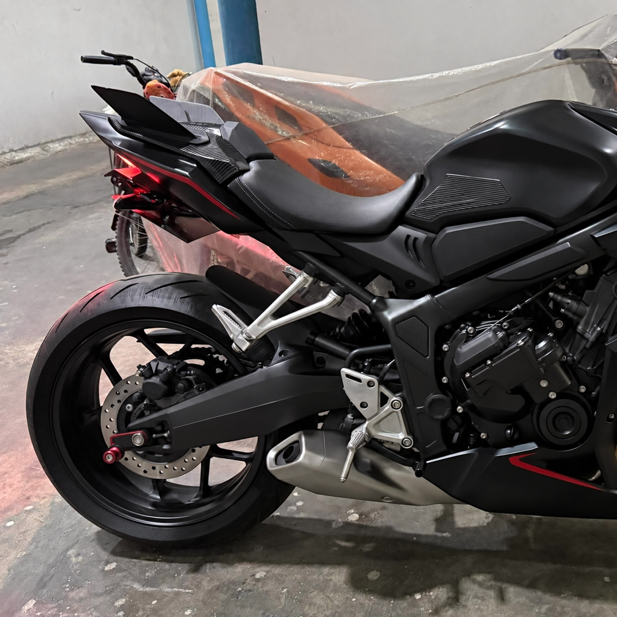 Rear winglets installed on a black CBR650R — side profile