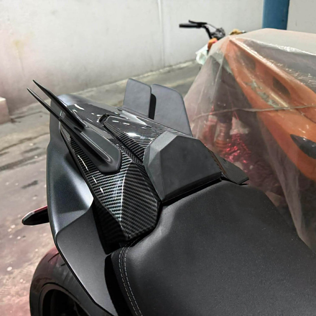 Rear winglets installed on a black CBR650R — top oblique view