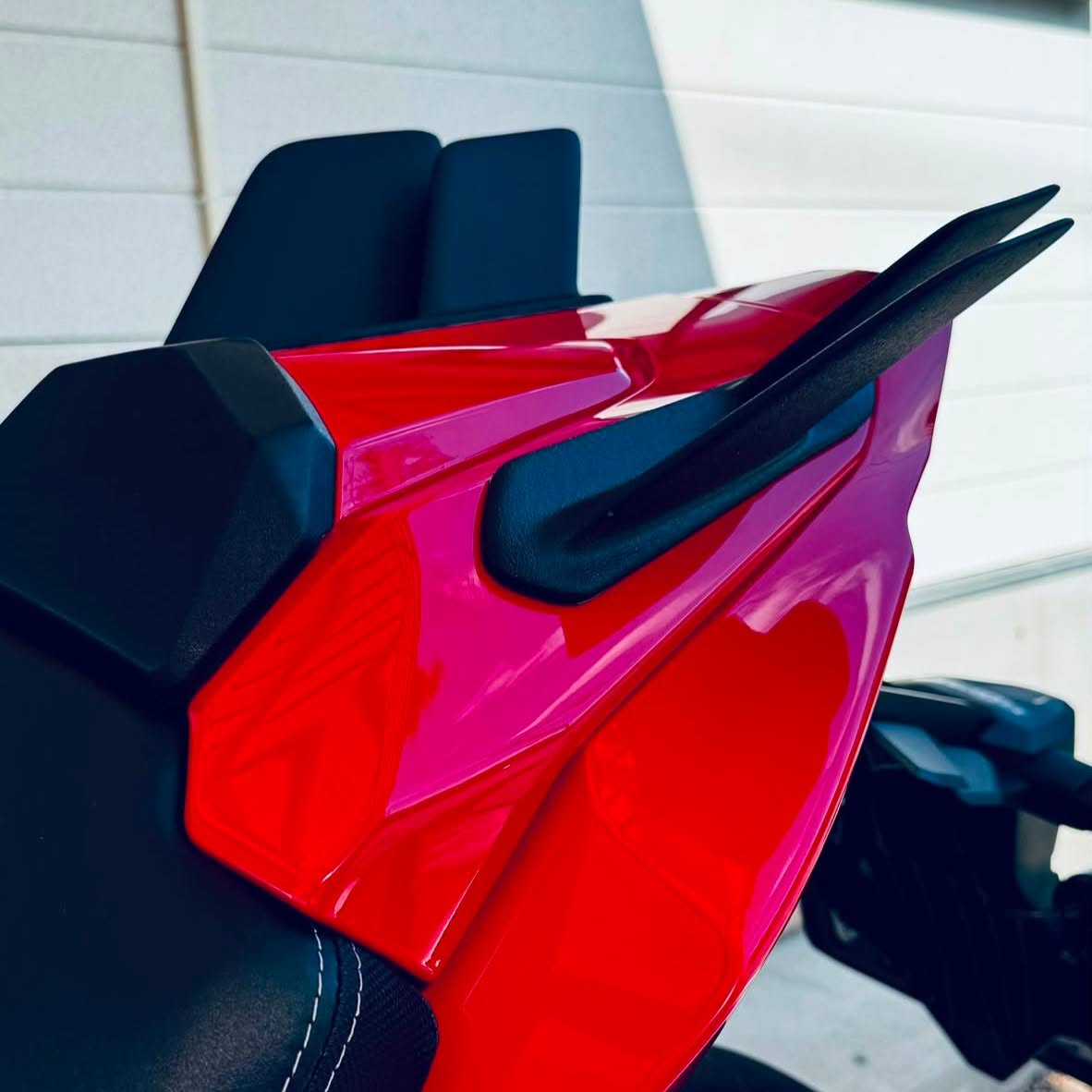 Twin-fin rear winglet detail installed on a red CBR650R