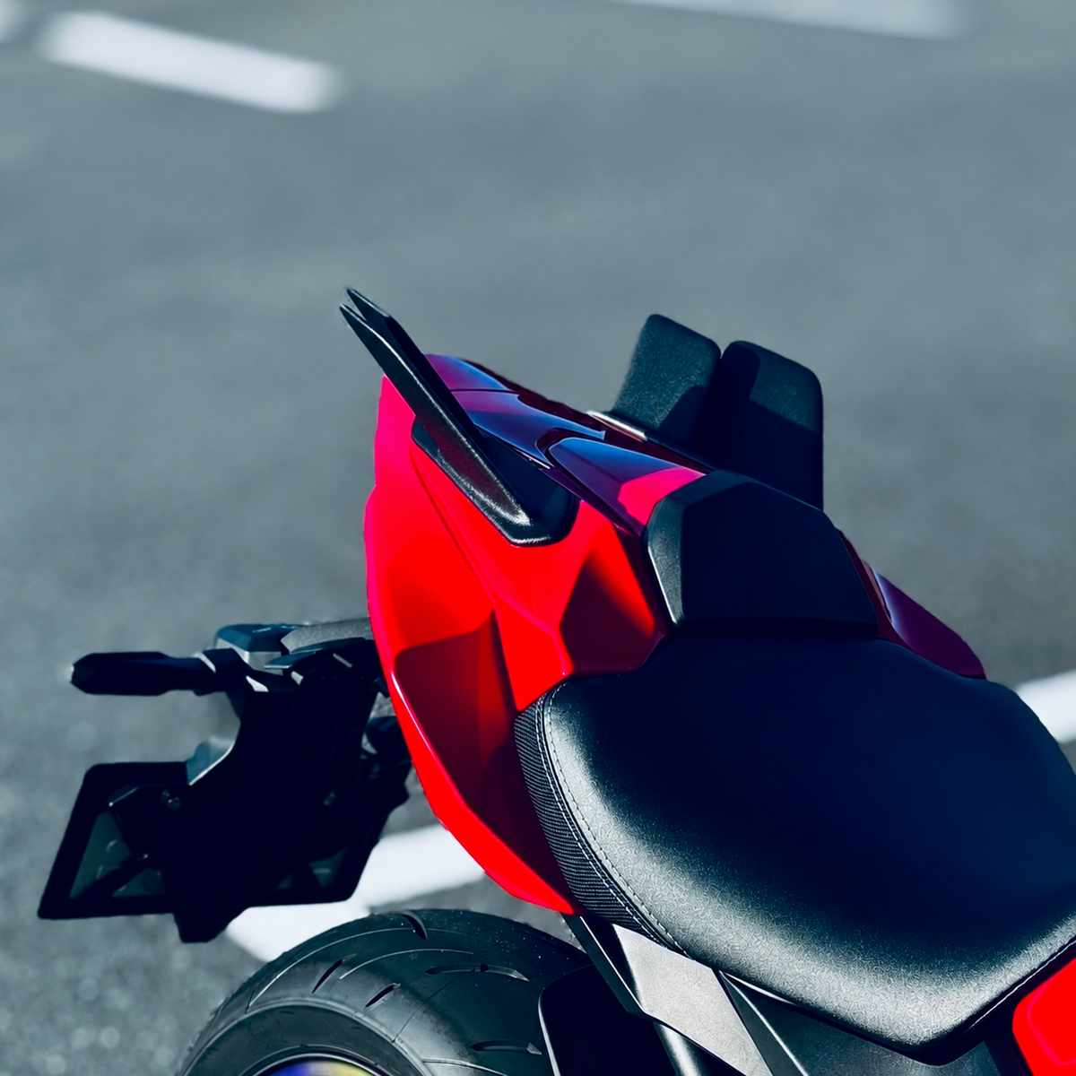 Rear winglets installed on a red CBR650R — top oblique view