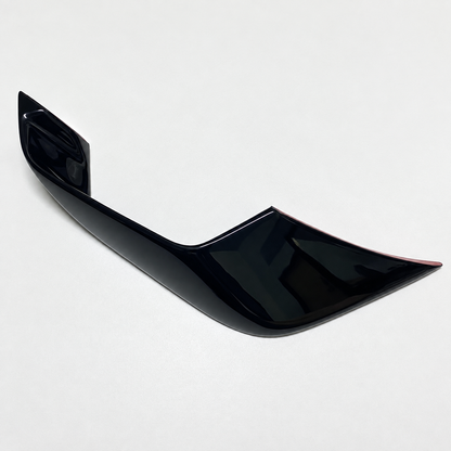 Close-up of one gloss-black YZF-R7 front winglet, showing its sculpted contour