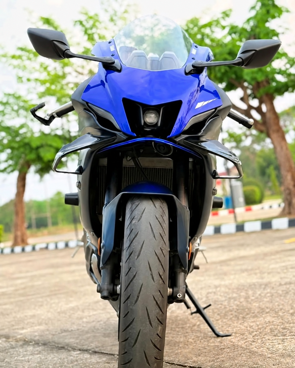 Front view of front winglets installed on a blue Yamaha R7
