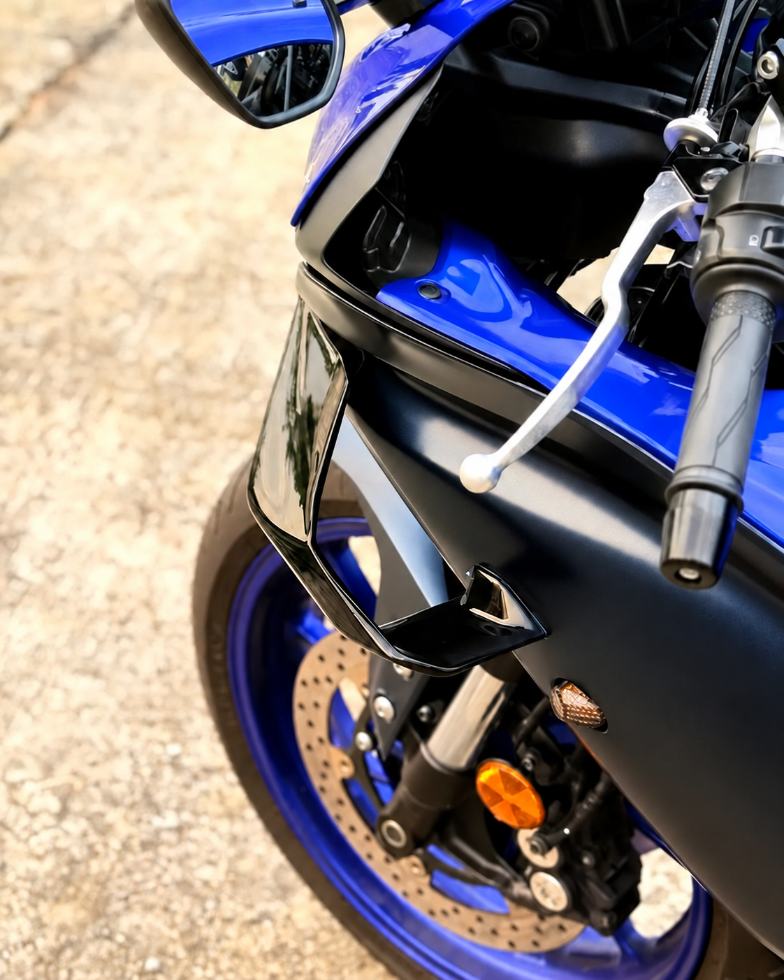 Close-up of left front winglet installed on a blue Yamaha R7